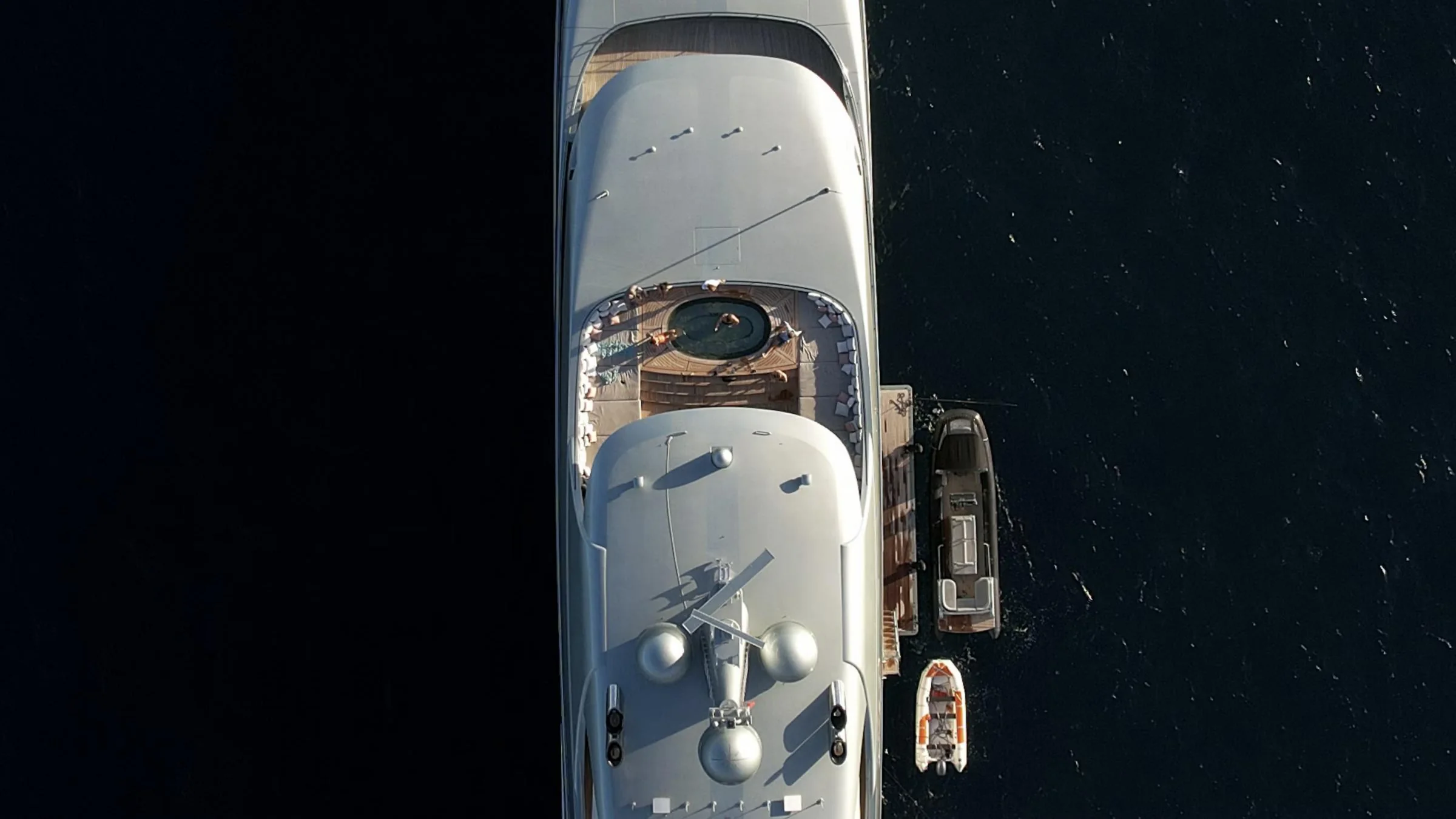 A large white motor yacht at anchor