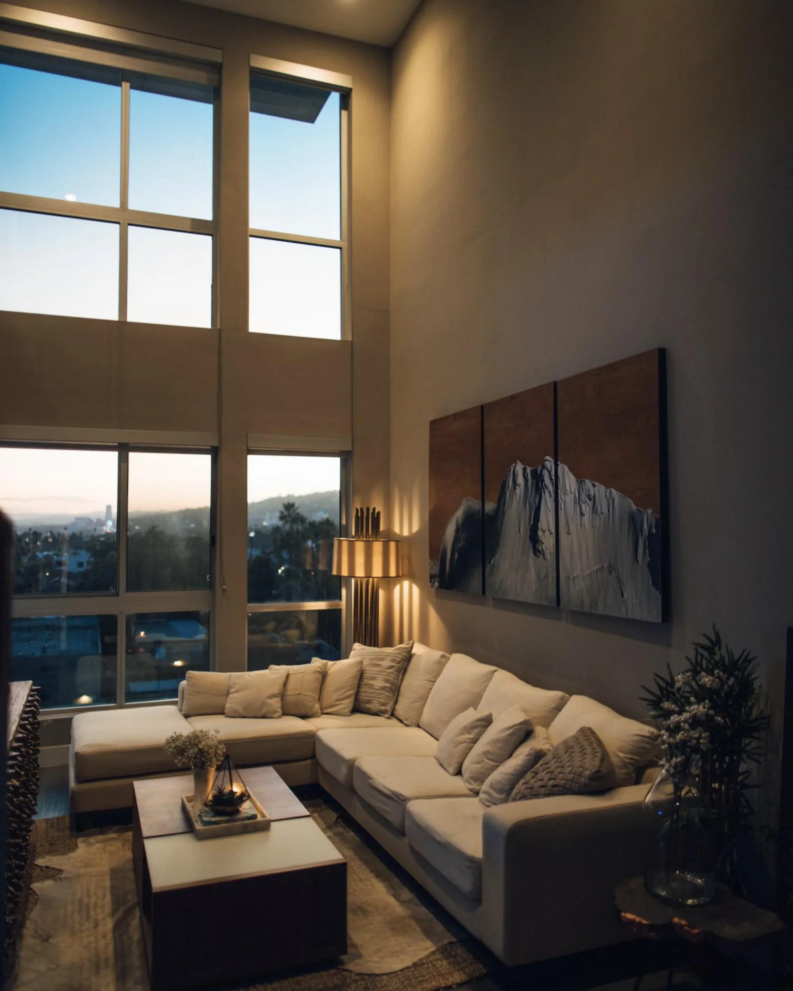 A quiet, light-filled living room with a chaise beside the window