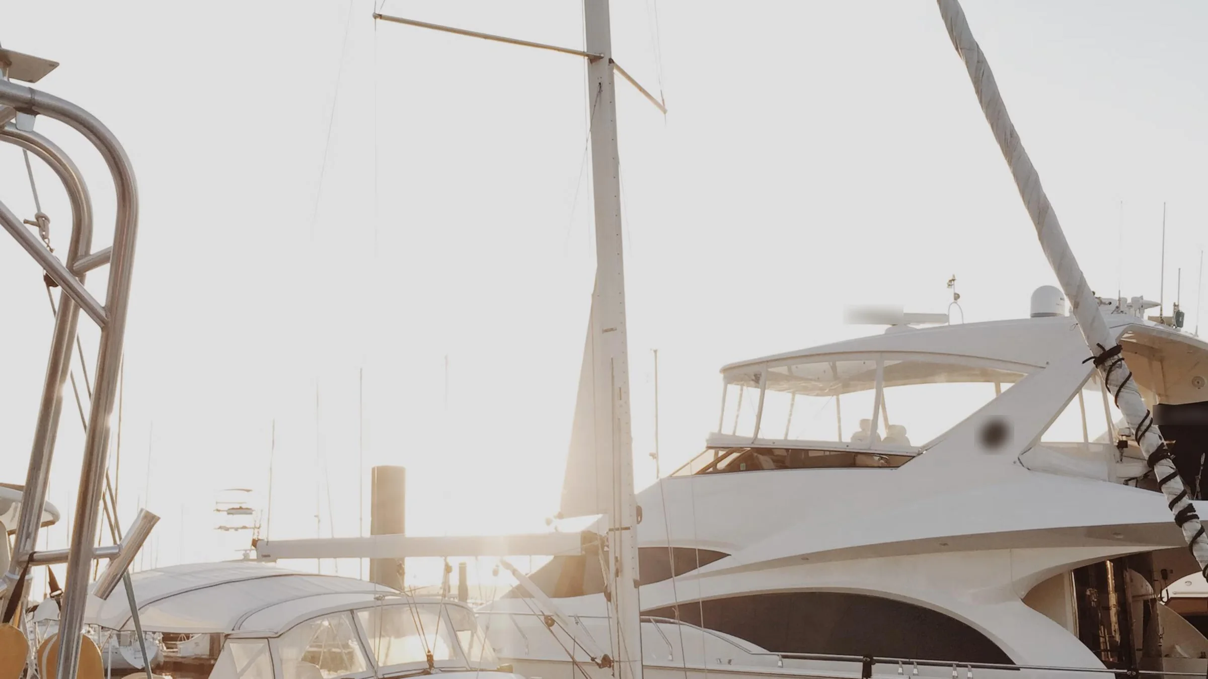 A white yacht moored at a dock